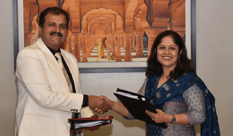 Professionals holding documents and shaking hands in meeting