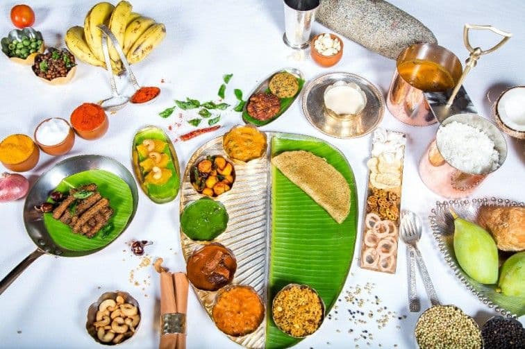 Traditional South Indian meals served on banana leaf plate with authentic dining setup